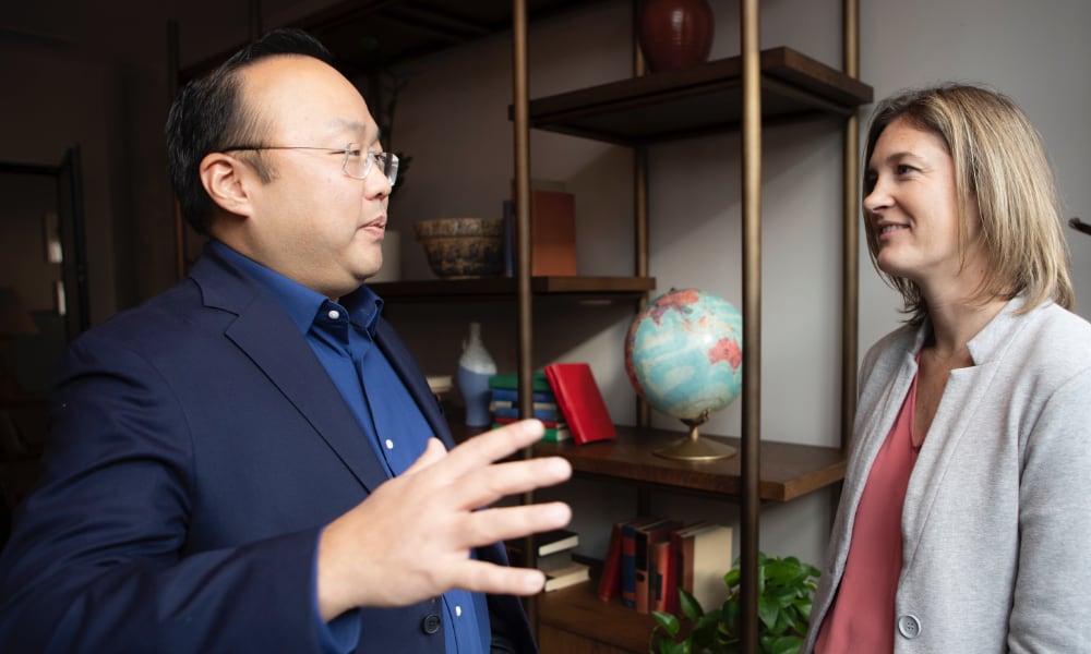 man talking to businesswoman