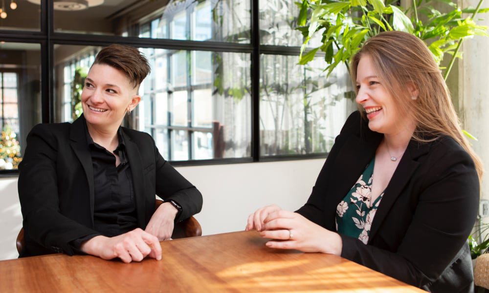 two laughing businesswomen