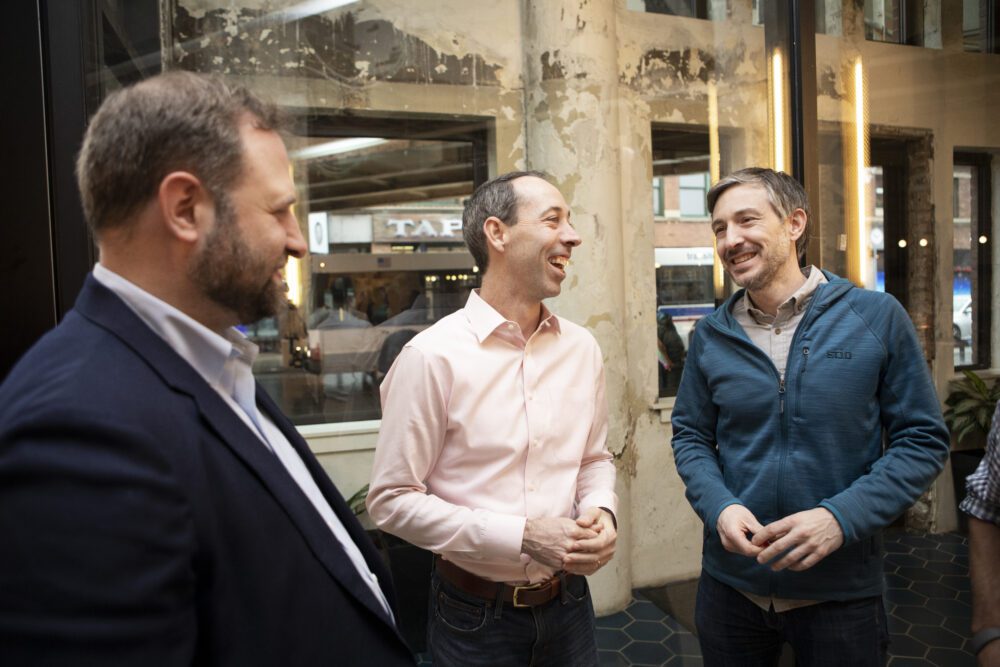 three men laughing